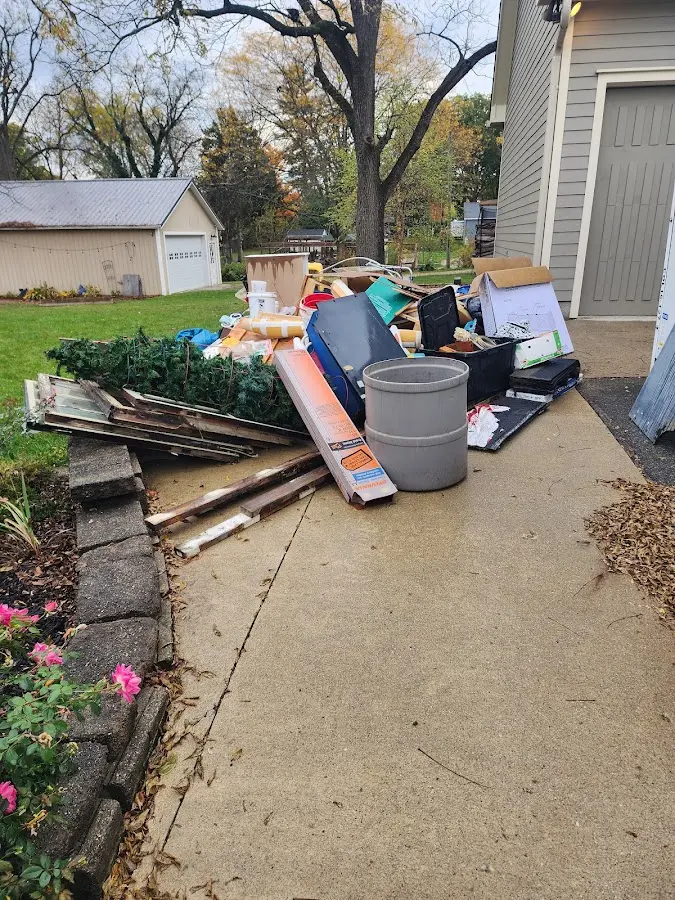 Dumpster being loaded with debris for 30 Yard Dumpster Rental in Edwardsville